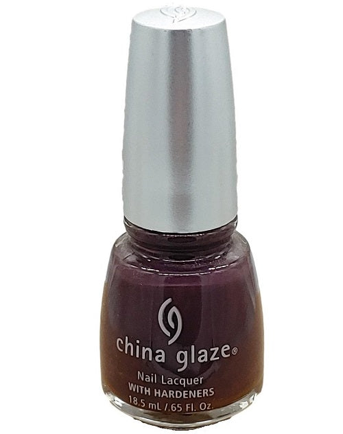 A bottle of China Glaze nail polish in a dark plummy purple color with subtle magenta shimmer, part of the Urban Chic-Platinum Collection.