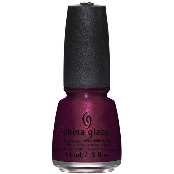 Red purple shimmer nail polish bottle with black cap on a white background