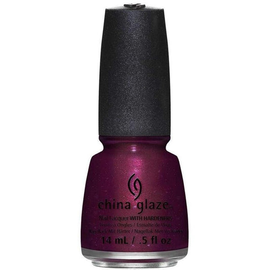 Red purple shimmer nail polish bottle with black cap on a white background