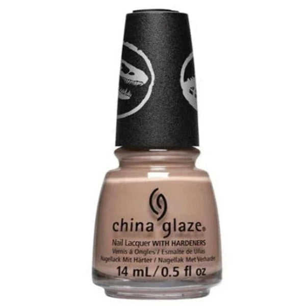 A bottle of China Glaze nail lacquer in a warm nude beige shade, featuring a black cap with a white dinosaur graphic and the brand name printed on the bottle.