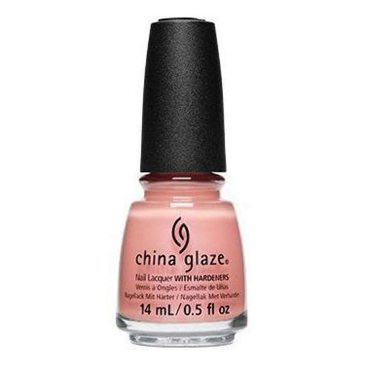 A bottle of China Glaze nail polish in a soft peach-pink shade, featuring a black cap and clear glass bottle on a white background.