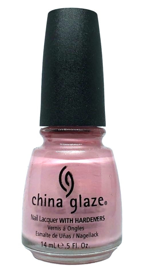 Pink nail polish bottle with black cap on a white background