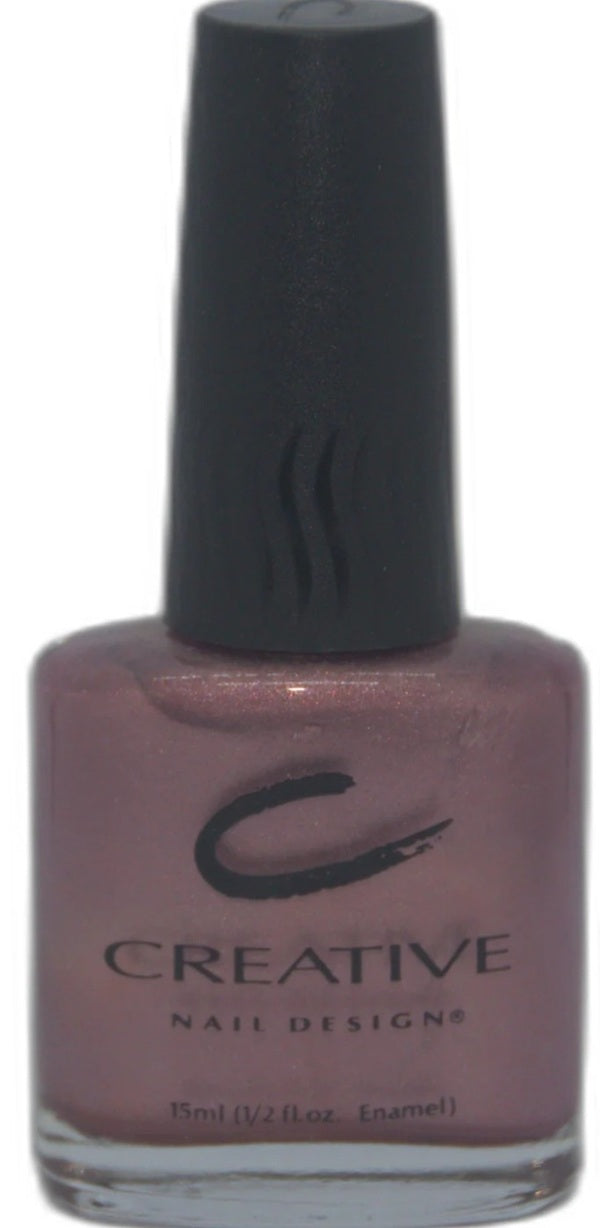 Nail polish bottle with 'Creative Nail Designs' logo on a white background