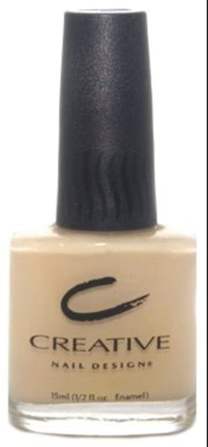 Creative Nail Design nail polish bottle with beige color and black cap on a white background