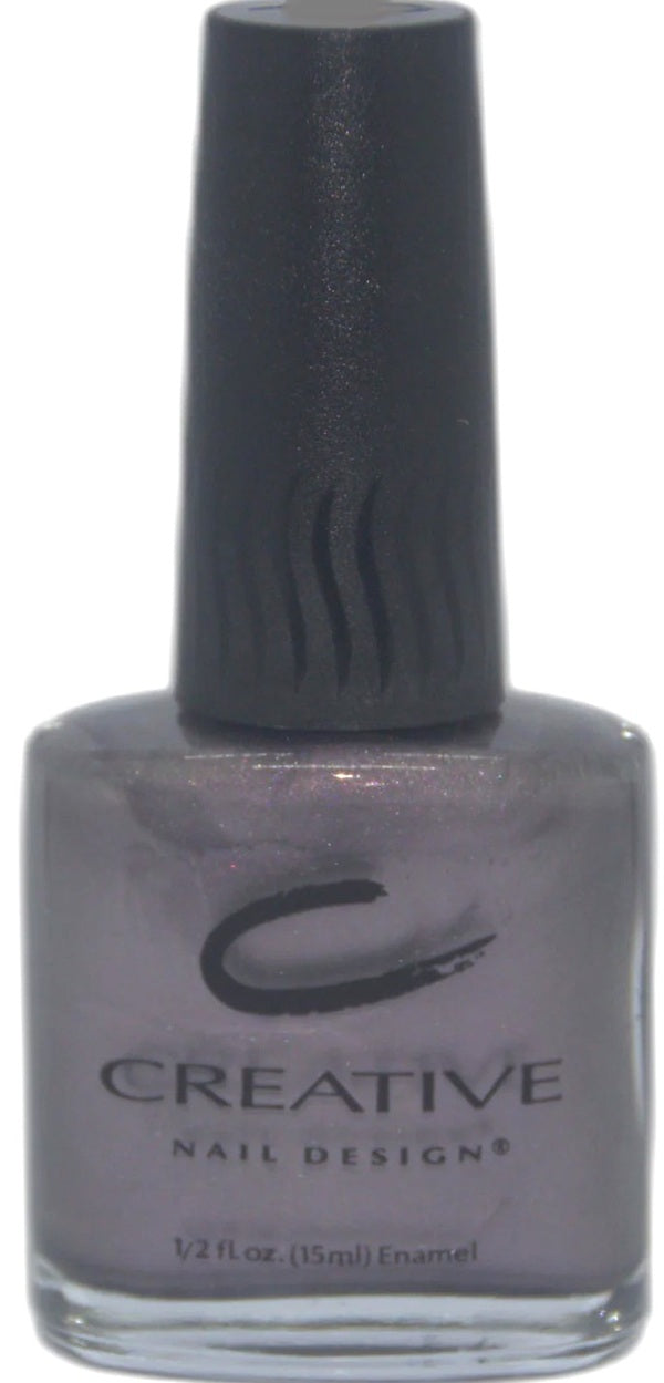Nail polish bottle with 'Creative Nail Designs' label on a white background