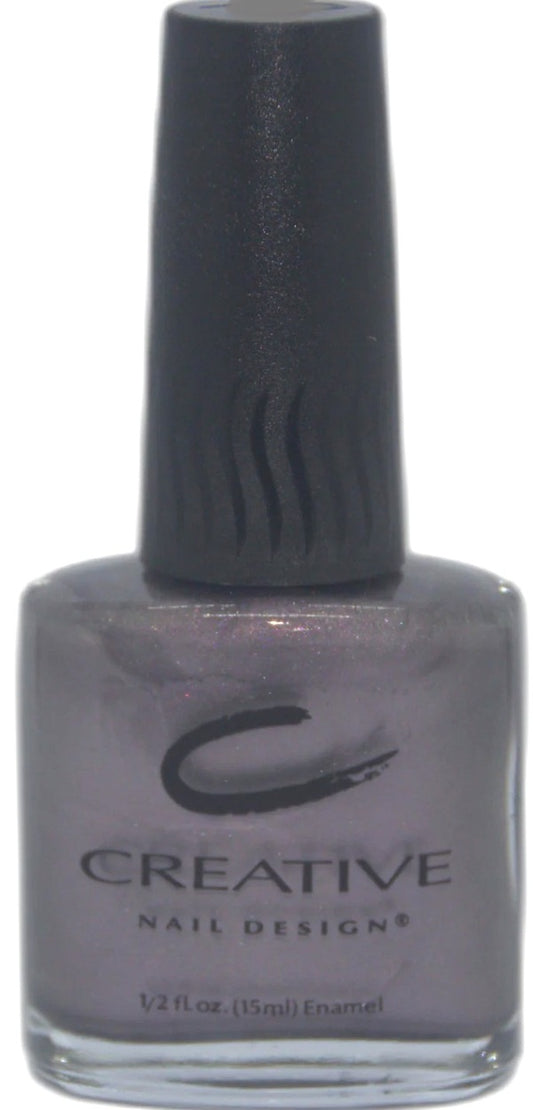 Nail polish bottle with 'Creative Nail Designs' label on a white background