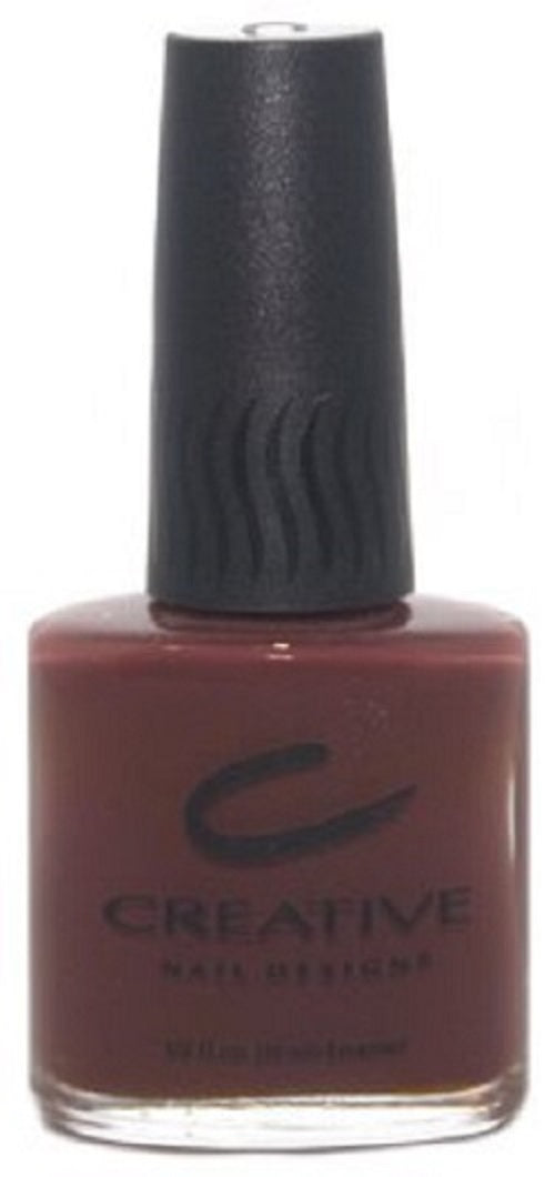 A bottle of Creative Nail Design nail polish in a dark warm chocolate brown color with subtle red undertones.