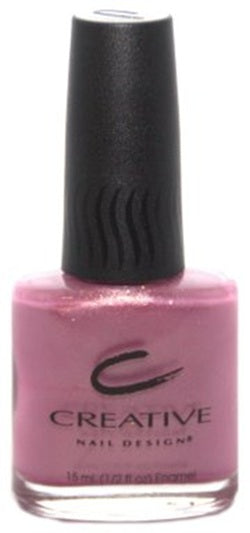 A bottle of Creative Nail Design nail polish in a lavender-toned pink color with a black cap.