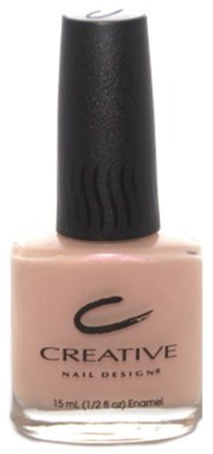 A bottle of Creative Nail Design nail polish in a light pink color with a black cap.