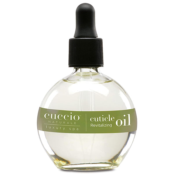 A bottle of Cuccio Naturale Revitalizing Cuticle Oil with a dropper cap, labeled for professional cuticle care with white limetta and aloe vera scent.