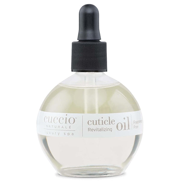 A bottle of Cuccio Naturale Revitalizing Cuticle Oil with a dropper cap, labeled for professional cuticle care, fragrance-free.