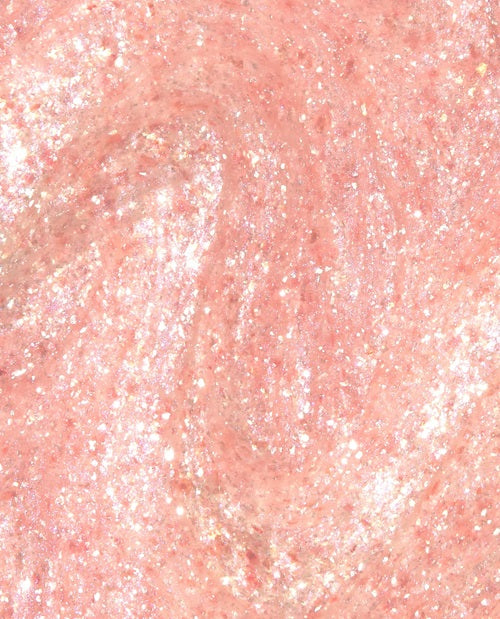 Close-up of pink shimmer nail polish swatch.