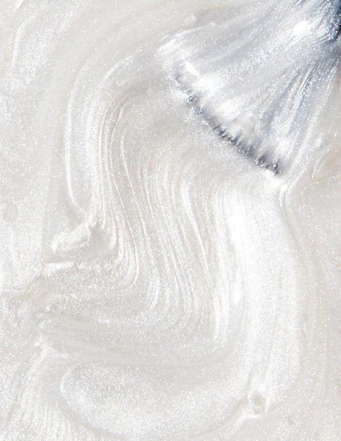 Close-up of OPI silvery white nail polish swatch with a brush