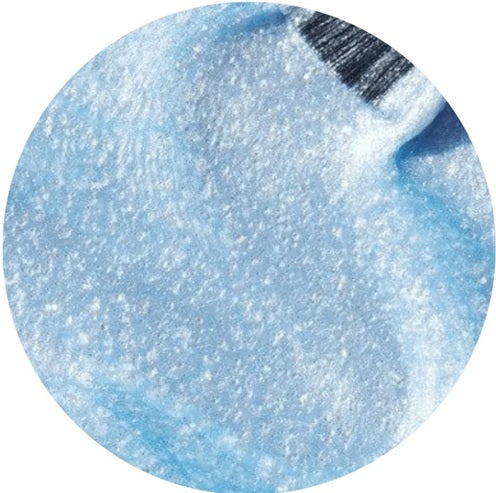 Close-up of a blue glittery nail polish swatch on a white background