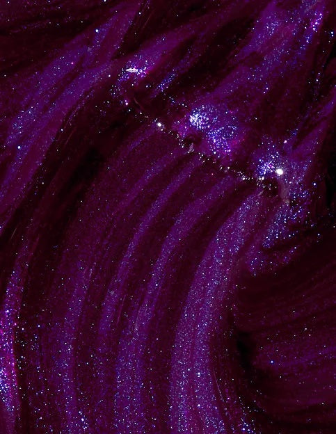 Close-up of purple shimmery nail polish swatch