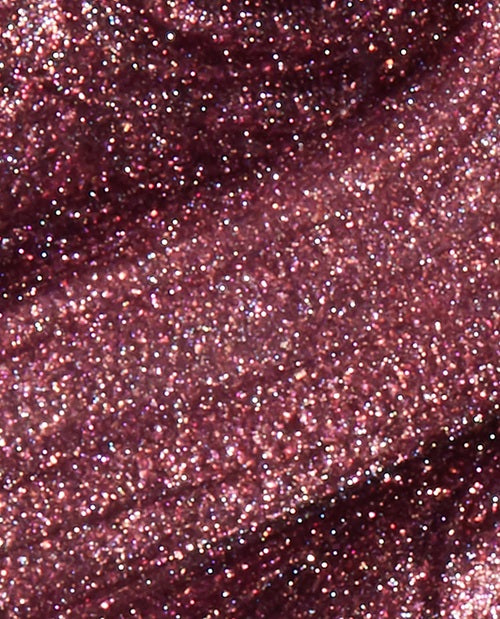 Close-up of mauve shimmer nail polish color.