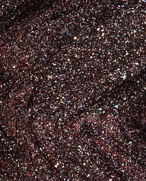 Close-up of dark glittery nail polish 