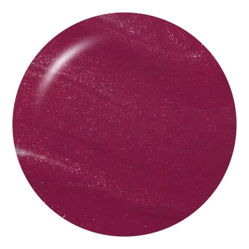Round deep maroon pink shimmer nail polish swatch.