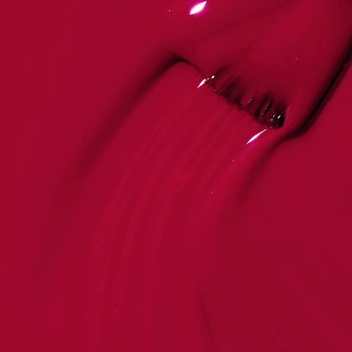Close-up of red nail polish swatch with brush.