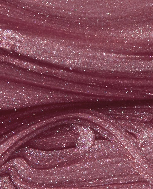 Close-up of pink mauve shimmer nail polish swatch.