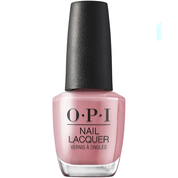 OPI nail polish bottle with pink polish and black cap on a white background
