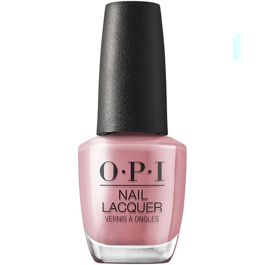 OPI nail polish bottle with pink polish and black cap on a white background