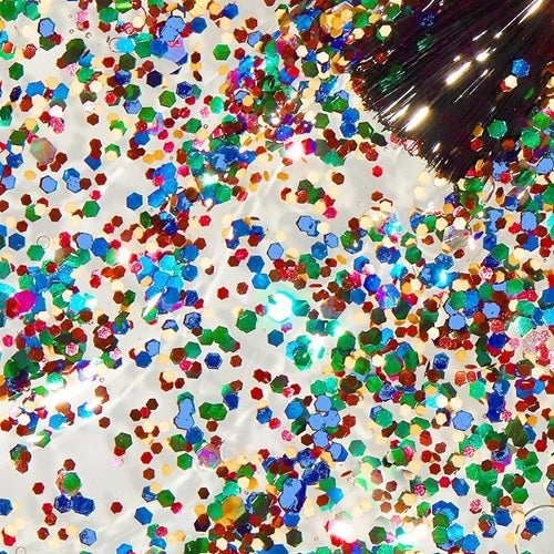 Multicolored nail polish glitter on a white background.