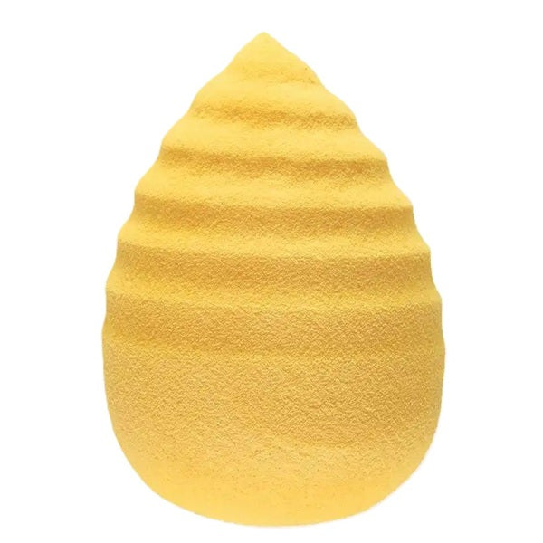 Yellow sponge with textured surface on a white background