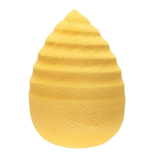 Yellow sponge with textured surface on a white background